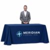 Navy printed tablecloth with a generic Meridian Consulting corporate logo, displayed on a rectangular table